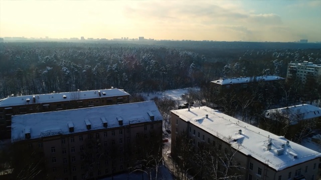 Video Reference: Aerial photography, Sky, Urban area, Winter, Bird-eye view, Photography, Roof, Snow, City, Landscape, Person