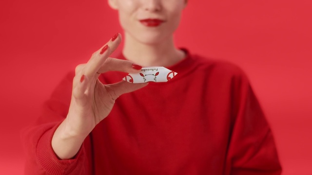 Video Reference: Red, Lip, Skin, Neck, T-shirt, Hand, Mouth, Finger, Fashion accessory, Flesh