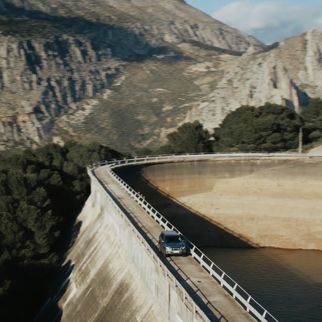 Video Reference: Dam, Water resources, Water, Reservoir, Infrastructure, River, Bridge, Mountain, Road, Nonbuilding structure