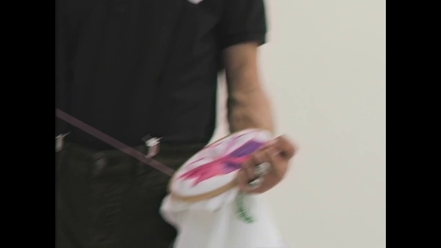 Video Reference: White, Shoulder, Pink, Handbag, Arm, Fashion, Bag, Hand, T-shirt, Joint, Person, Indoor, Holding, Man, Cake, Standing, Table, Front, Dress, Cut, Woman, Black, Young, Wearing, Shirt, Cutting, Blue, Teeth, Room, Clothing