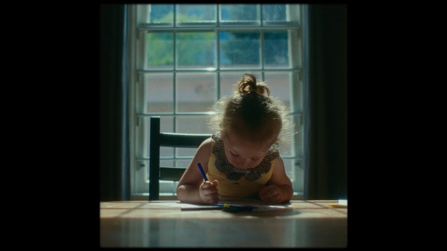 Video Reference: photograph, person, sitting, child, snapshot, girl, toddler, fun, human, arm