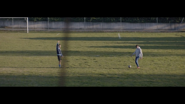 Video Reference: Player, Sport venue, Football, Sports equipment, Team sport, Football player, Grass, Ball game, Atmosphere, Sports