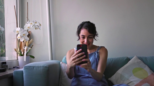 Video Reference: Sitting, Electronic device, Technology, Room, Drinking, Gadget, Photography, Long hair, Vacation, Mobile phone