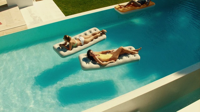 Video Reference: Leisure, Water park, Games, Recreation, Water transportation, Swimming pool, Table, Sun tanning, Furniture, Vehicle