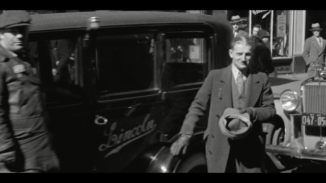Video Reference: motor vehicle, car, man, black and white, monochrome photography, vehicle, mode of transport, gentleman, snapshot, photography, Person