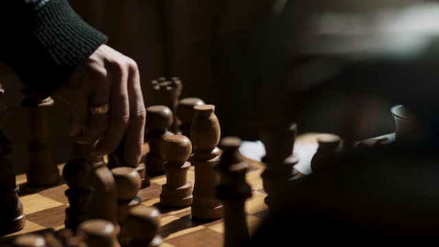 Video Reference: Games, Chessboard, Indoor games and sports, Chess, Recreation, Board game, Tabletop game, Hand, Photography, Sports equipment