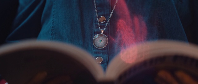 Video Reference: Blue, Turquoise, Button, Electric blue, Neck, Ear, Fashion accessory, Jeans, Outerwear, Photography