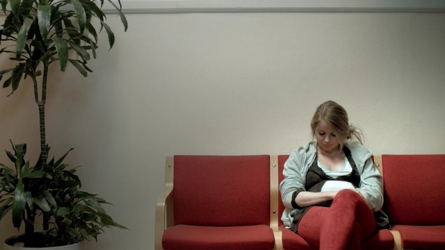Video Reference: room, sitting, girl, furniture, interior design, plant, couch, window, Person