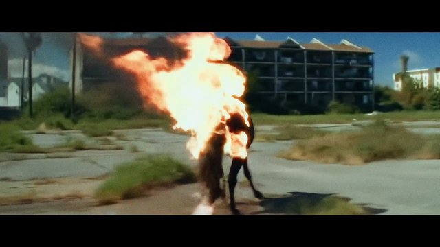 Video Reference: fire, person, burning, flames, outdoor, urban, building, action, danger, smoke, street, dramatic, stunt, explosion