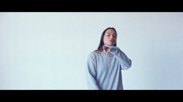 Video Reference: White, Photograph, Shoulder, Head, Outerwear, Standing, Snapshot, Cheek, Arm, Sitting, Person