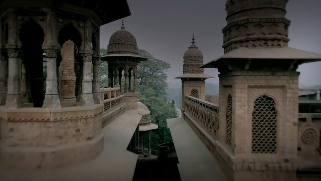Video Reference: landmark, historic site, tourist attraction, temple, building, symmetry, sky, mausoleum, column, arch, Person