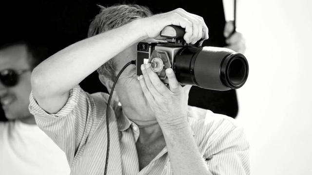 Video Reference: photographer, photograph, black and white, photography, single lens reflex camera, camera operator, microphone, cinematographer, cameras & optics, camera accessory