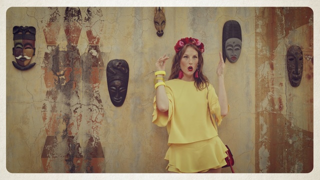 Video Reference: Wall, Yellow, Visual arts, Fashion, Art, Headgear, Long hair, Fashion accessory, Illustration, Fashion design, Person