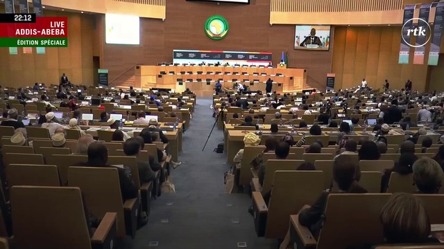 Video Reference: Auditorium, Event, Academic conference, Convention, Government, Building, Audience, Parliament, News conference, Convention center