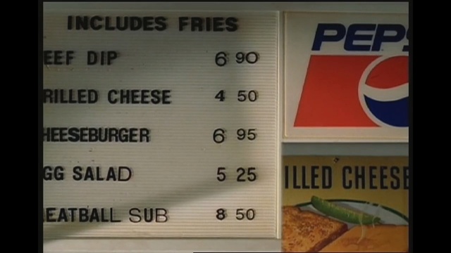 Video Reference: text, signage, sign, font, material, number, advertising, Person