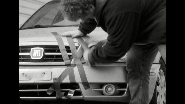 Video Reference: car, motor vehicle, white, black, photograph, black and white, vehicle, automotive design, monochrome photography, mode of transport, Person