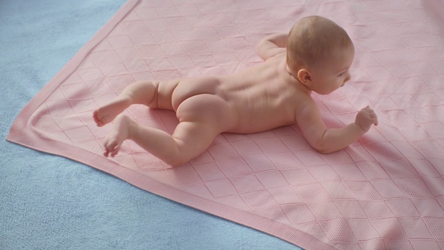 Video Reference: Child, Baby, Skin, Pink, Tummy time, Linens, Mattress, Crawling, Stomach