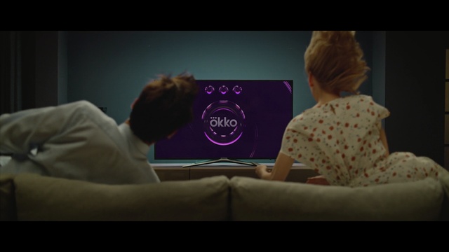 Video Reference: purple, screenshot, sitting, girl, television, multimedia, media, scene, conversation, space