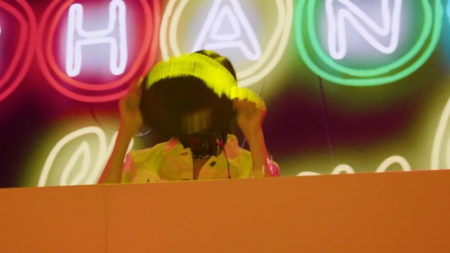 Video Reference: Yellow, Fun, Font, Performance, Graphics, Art, Graphic design, Illustration, Talent show, Stage, Person, Box, Food, Table, Close, Sign, Clock, Holding, Standing, Red, Game, Man, Painting, Child art, Spectacles