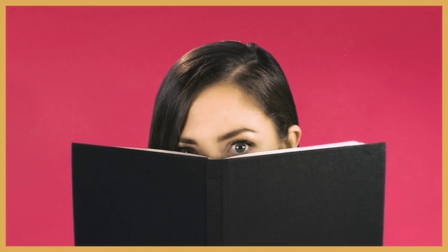 Video Reference: Forehead, Reading, Laptop, Person, Indoor, Sitting, Computer, Screen, Monitor, Front, Young, Woman, Looking, Television, Using, Table, Man, Black, Large, Shirt, Red, Apple, Girl, White, Text, Human face, Wall, Electronics, Screenshot, Clothing