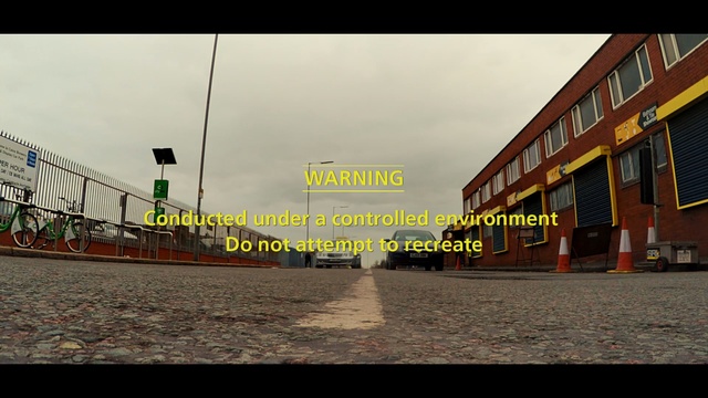 Video Reference: sky, urban area, town, structure, road, residential area, car, area, city, lane