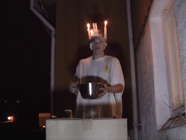 Video Reference: Fun, Art, Cabinet, Indoor, Man, Kitchen, Stove, Oven, Table, Standing, Woman, White, Holding, Candle, Person