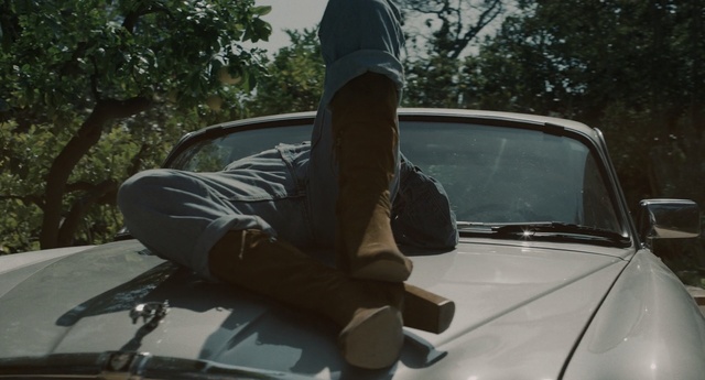 Video Reference: car, motor vehicle, land vehicle, vehicle, mode of transport, automotive exterior, windshield, glass, family car, automotive design, Person