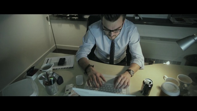 Video Reference: Plumbing fixture, Art, Person, Indoor, Man, Preparing, Kitchen, Looking, Front, Window, Table, Woman, Food, Holding, Standing, Cutting, Hand, Wearing, Using, Knife, Shirt, Computer, Young, Cooking, Sink, Stove, Wall, Laptop