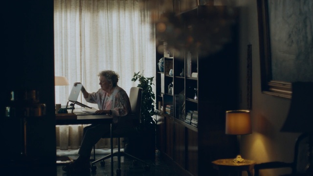 Video Reference: darkness, lighting, audio, window, girl, table, interior design, furniture, glass, Person