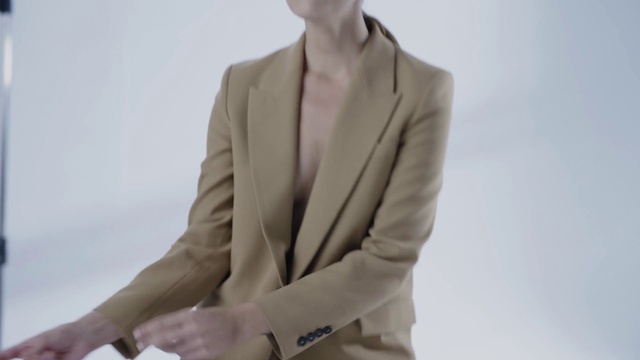 Video Reference: Outerwear, Clothing, Beige, Blazer, Jacket, Suit, Top, Formal wear, Neck, Mannequin