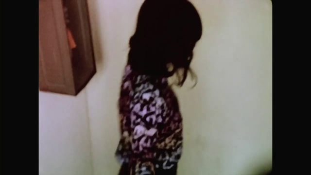 Video Reference: Hair, Clothing, Hairstyle, Dress, Long hair, Neck, Shoulder, T-shirt, Arm, Black hair