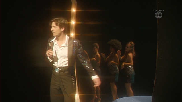 Video Reference: Performance, Event, Performing arts, Talent show, Performance art, Fun, Stage, Pop music, Singer, Concert, Person, Standing, Woman, Man, Front, Holding, Looking, Dress, Glasses, Wedding, Wine, Posing, Girl, Young, Suit, Table, Wearing, Walking, Street, Cake, White, People, Clothing, Dance, Human face