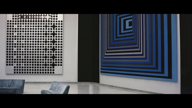 Video Reference: blue, black, text, wall, structure, architecture, symmetry, design, font, line, Person