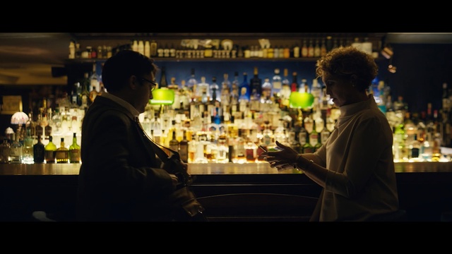 Video Reference: distilled beverage, alcoholic beverage, liqueur, bar, alcohol, drink, night, darkness, whisky, Person