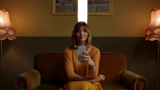 Video Reference: Sitting, Room, Conversation, Photography, Furniture, Couch, Long hair, Comfort, Brown hair