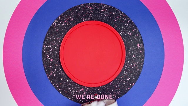 Video Reference: Pink, Circle, Plate, Games, Recreation, Magenta, Sign, Black, Food, Sitting, Red, Table, Open, Holding, Computer, Bowl, White, Art, Design, Round, Abstract, Dishware