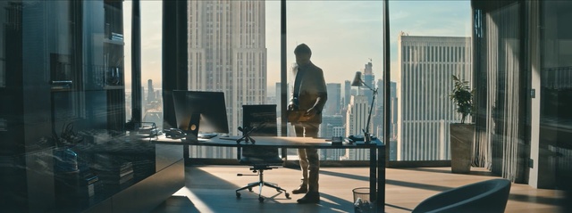 Video Reference: Desk, Standing, Office, Furniture, Interior design, Building, Table, Sitting, Window, White-collar worker, Person