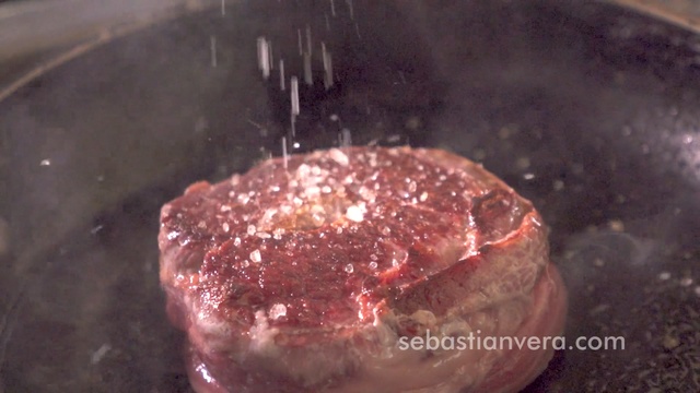 Video Reference: Food, Dish, Cuisine, Red meat, Beef, Animal fat, Venison, Ingredient, Flesh, Beef tenderloin, Indoor, Sitting, Piece, Cake, Ice, Table, Chocolate, Covered, Clear, Plate, Counter, Glass, Close, Half, Snow, Fork, Pan, White, Fish, Reef, Barbecue