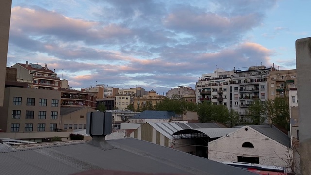 Video Reference: Sky, Neighbourhood, Residential area, Urban area, Daytime, Town, City, Human settlement, Cloud, Roof