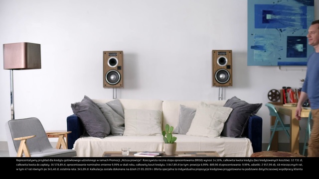 Video Reference: Living room, Room, Furniture, Property, Couch, Wall, Interior design, Audio equipment, Loudspeaker, Table