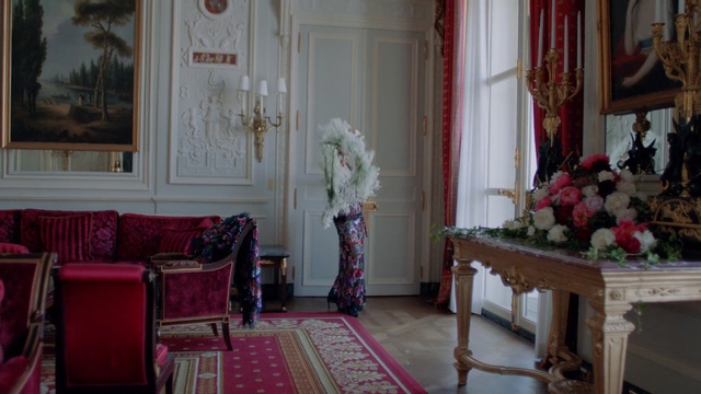 Video Reference: Room, Interior design, Furniture, Living room, Building, Floral design, Curtain, Chair, House, Home, Person