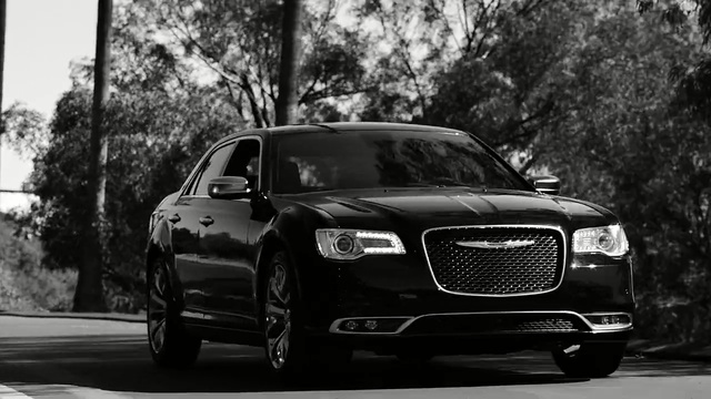 Video Reference: car, motor vehicle, black, automotive design, luxury vehicle, vehicle, black and white, mid size car, photography, automotive wheel system, Person