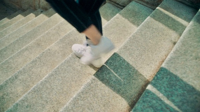 Video Reference: Leg, Footwear, Shoe, Floor, Sidewalk, Shadow, Ankle, Road surface, Foot, Human leg