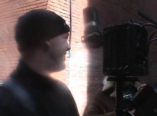 Video Reference: audio, black hair, darkness, neck, facial hair, microphone