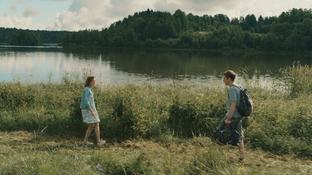 Video Reference: People in nature, Nature, Natural landscape, Nature reserve, Wilderness, Grass, Water, Lake, Bank, Grass, Person