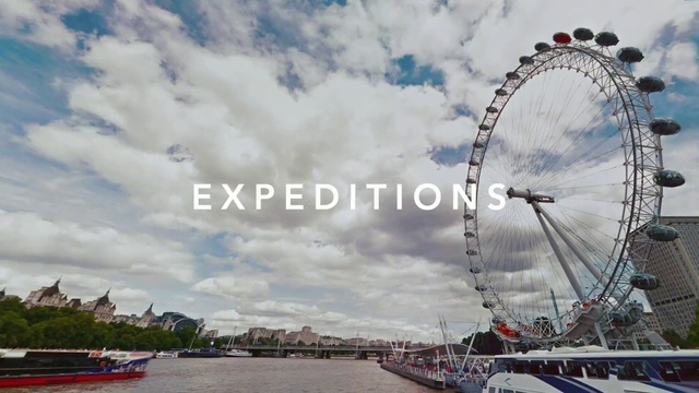 Video Reference: Ferris wheel, Landmark, Tourist attraction, Sky, Wheel, River, Recreation, Cloud, Vehicle, Waterway