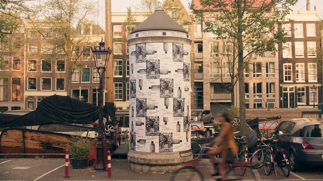 Video Reference: urban area, city, tree, town, neighbourhood, metropolis, building, street, downtown, town square, Person