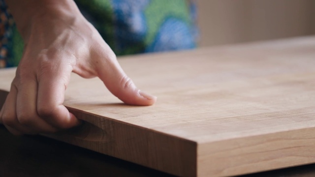 Video Reference: Wood, Hardwood, Wood stain, Cutting board, Hand, Table, Finger, Plywood, Flooring, Furniture