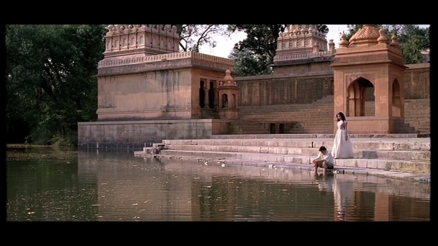 Video Reference: water, reflection, tourist attraction, temple, archaeological site, tree, reflecting pool, water feature, monument, ancient history