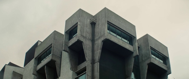 Video Reference: Architecture, Brutalist architecture, Commercial building, Daytime, Building, Metropolitan area, Facade, Corporate headquarters, Mixed-use, Symmetry